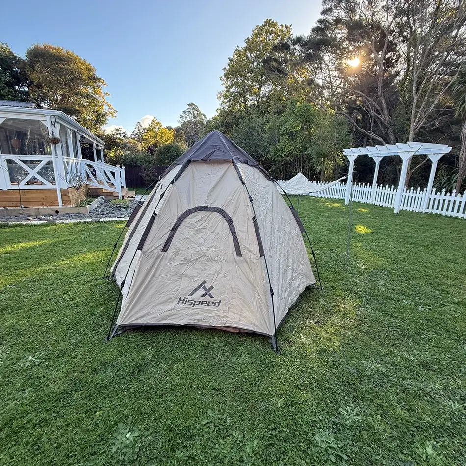 Double-Layer Hexagon Tent in Cream, set up in an Auckland backyard
