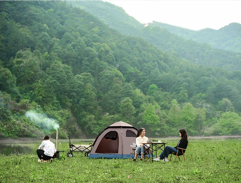 3-4 Person Automatic Pop-Up Tent pitched at a lakeside campsite